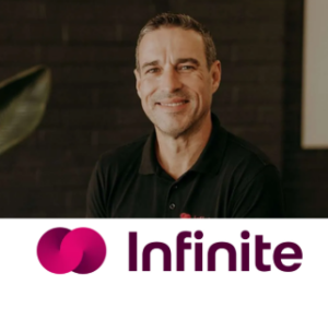 Tim, Managing Director of Infinite Wealth, smiling in a black branded polo shirt | How Infinite Wealth Got 100+ Leads With Google Ads