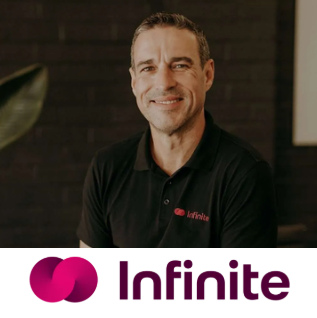 Tim, Managing Director of Infinite Wealth, smiling in a black branded polo shirt | How Infinite Wealth Got 100+ Leads With Google Ads